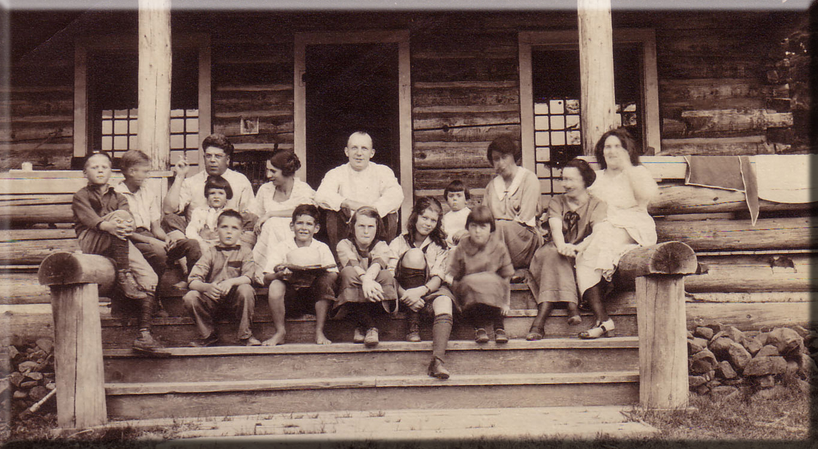 Family on front porch steps