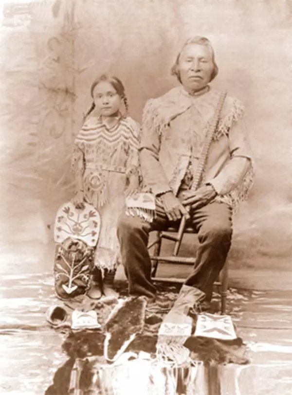 Tribe member with child