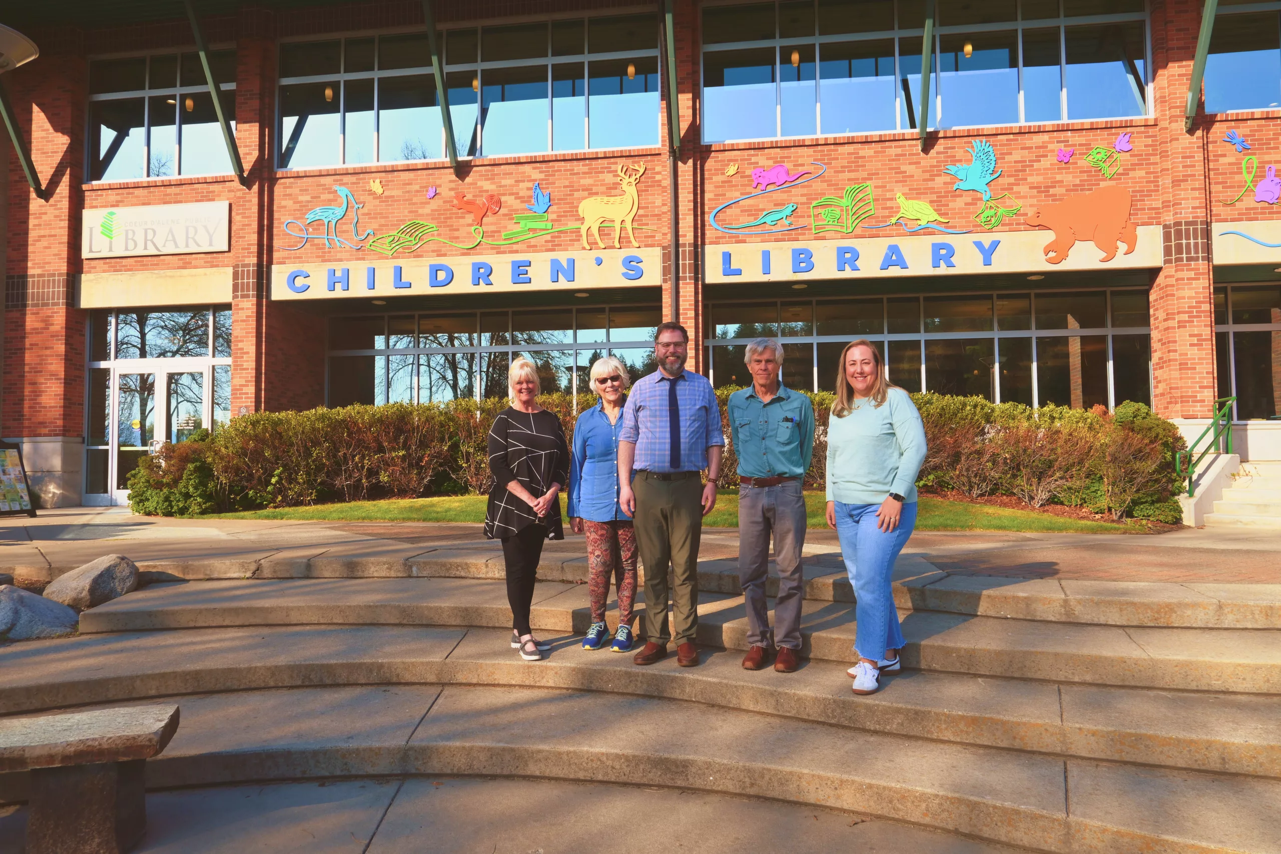 Library Board of Trustees outside the children's library